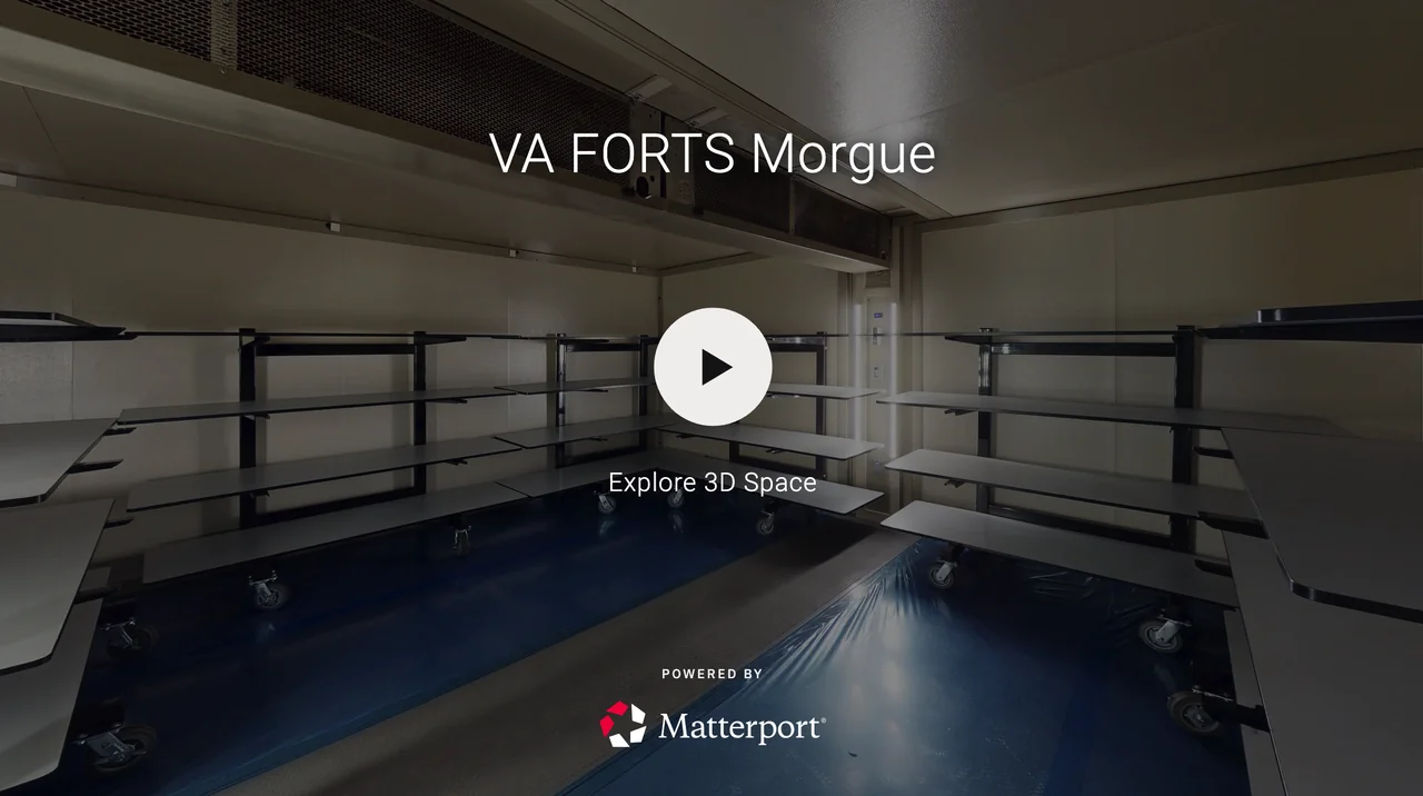 Empty mobile hospital room with empty shelves on wheels at VA FORTIS Morgue, powered by Matterport.